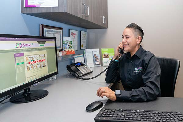 A person from Picasso Dental Care's team responding to a patient call.