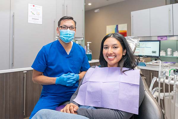 A woman smiling in dental chair with Dr. Le at Picasso Dental Care in Temecula, CA A woman smiling in dental chair with Dr. Le at Picasso Dental Care in Temecula, CA
